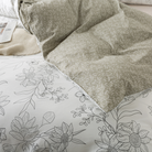 The back of this FADFAY comforter set features an elegant beige leaf pattern.