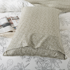 The FADFAY pillowcase is decorated with beige-colored leaves.