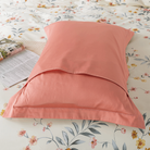 The back side of this FADFAY pillowcase is primarily pure pink.